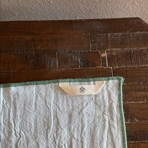 White Textured Fabric with Green Trim hearth and hand